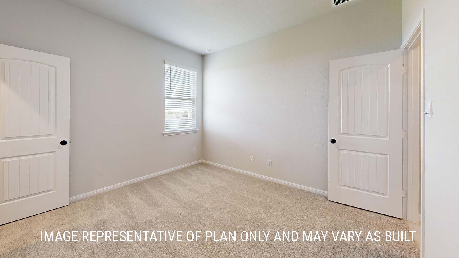 Waverley secondary bedroom with carpeted flooring and window for lighting.
