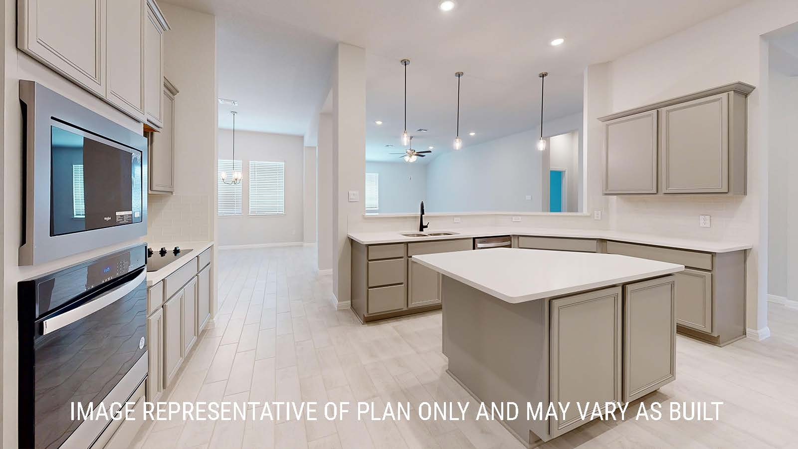 Waverley kitchen with center kitchen island with light cabinets and granite countertops.
