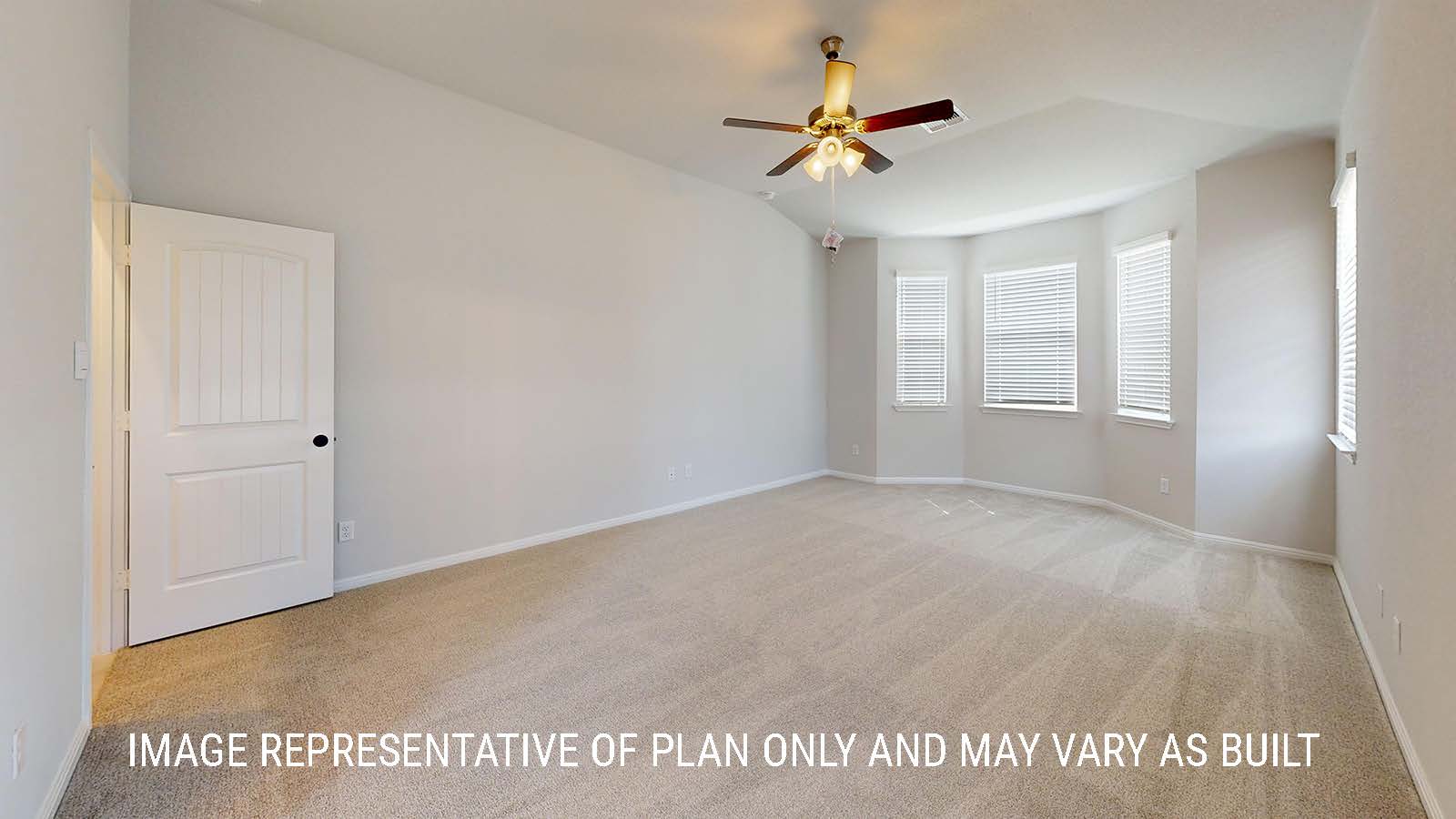Waverley primary bedroom with carpeted flooring and windows for lighting.