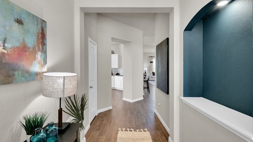 Sterling Meadows model home entry view of living room and kitchen.