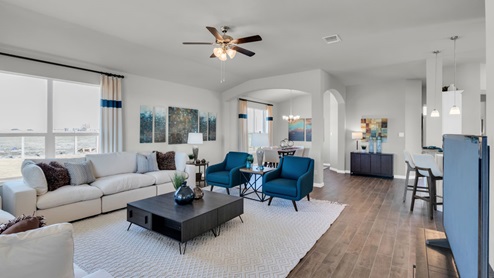 Sterling Meadows model home living room with view of dining room.