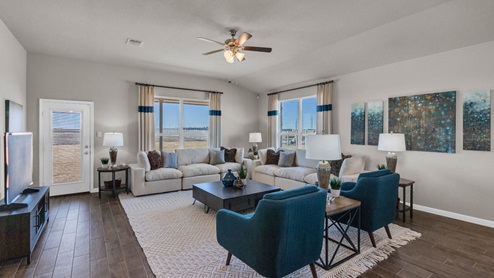 Sterling Meadows model home living room with view of the backyard.