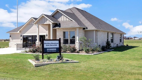 Sterling Meadows model home exterior elevation with glass store front windows.
