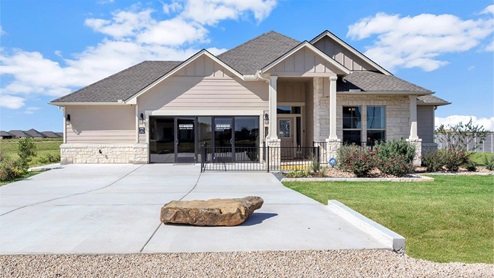 Sterling Meadows model home exterior elevation with glass store front windows.