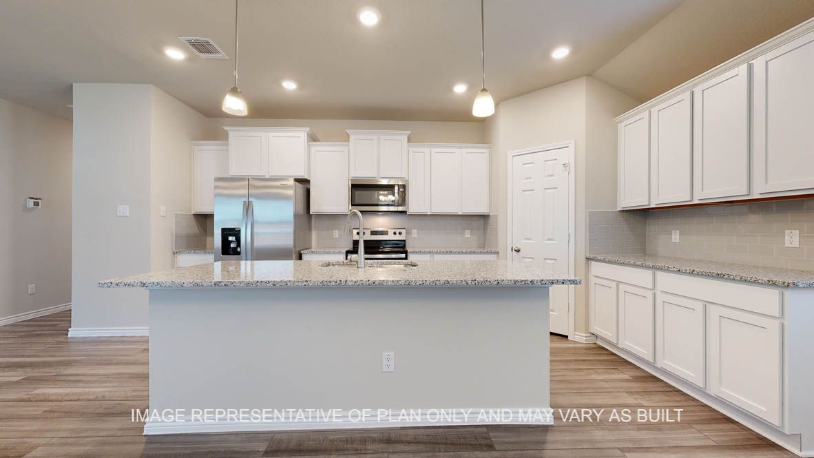 Elmwood kitchen with larger center island and undermount sink.