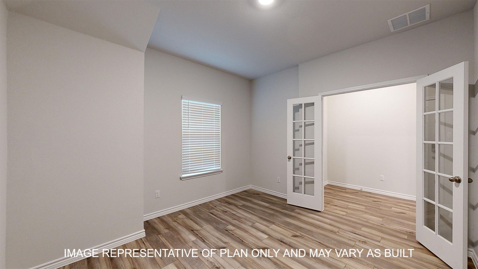 Everett study with vinyl plank flooring and glass French doors.