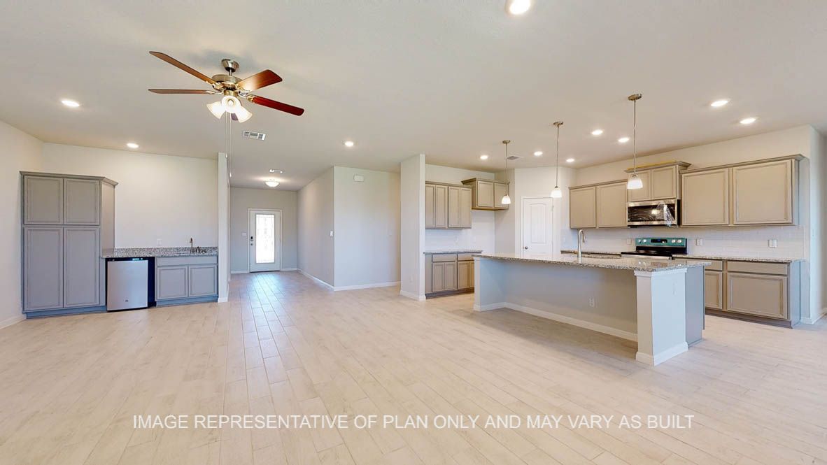 Parker kitchen with view to living room and wet bar.