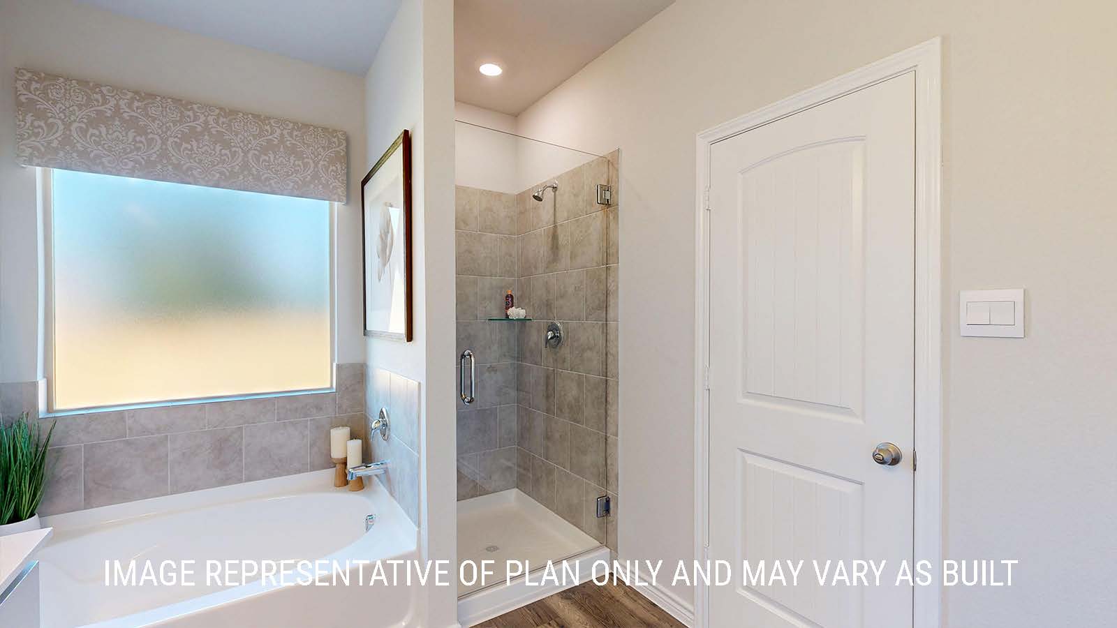 Newburgh primary bathroom with garden tub and walk-in shower.
