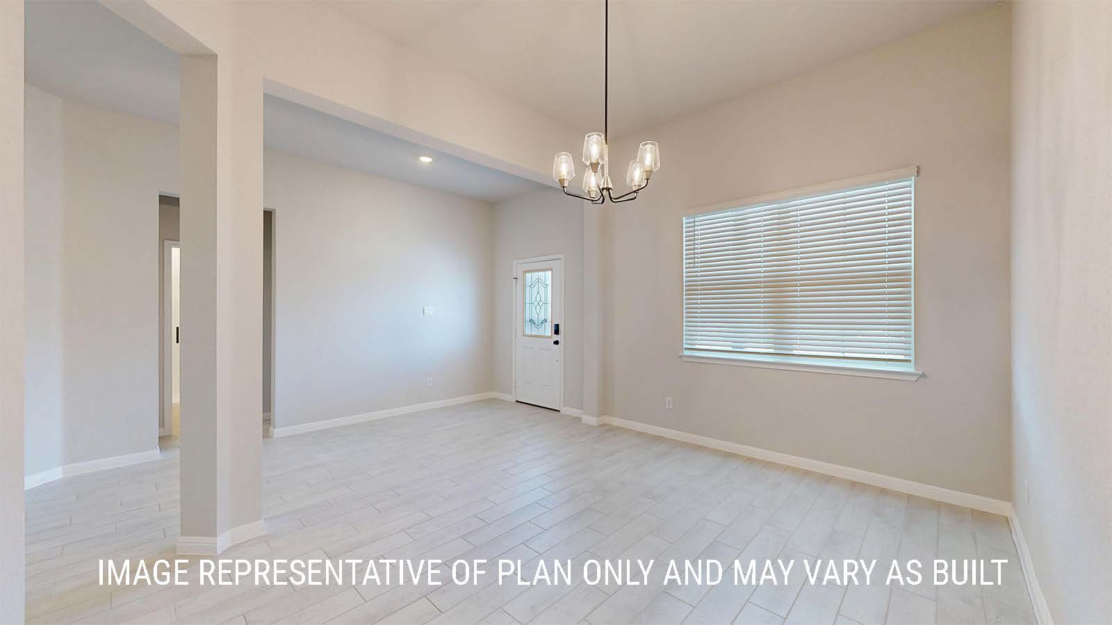 Waverley entry way with view of dining room and window for lighting.
