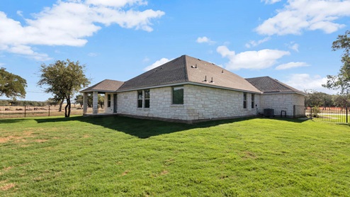 Delaware Springs model home backyard with a gated fence.