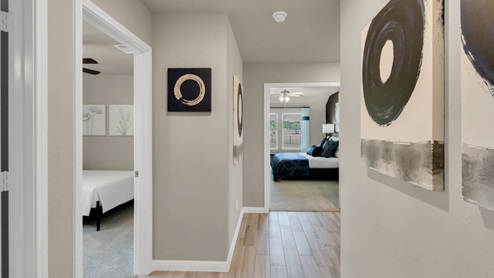 Delaware Springs model home hallway entry with view of master bedroom.