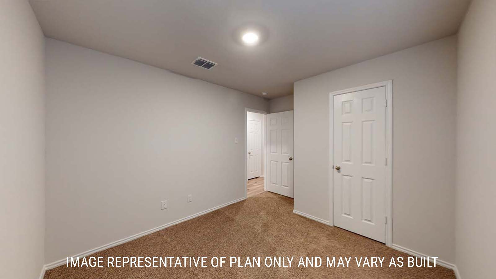 Ashburn secondary bedroom with closet and carpeted flooring.