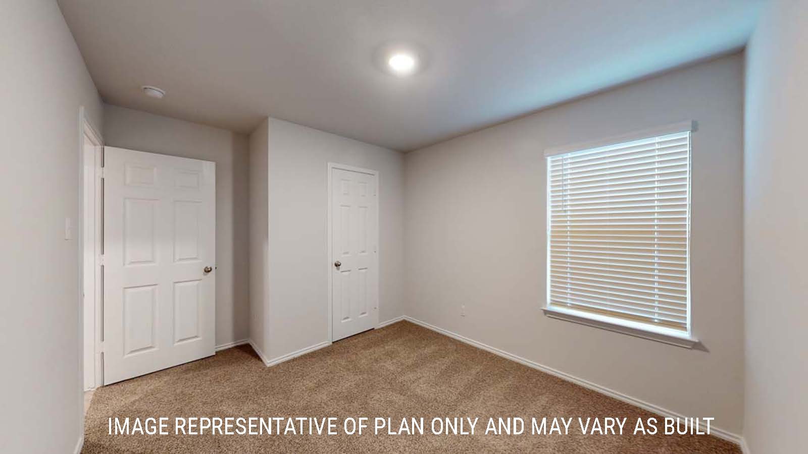 Ashburn secondary bedroom with window and carpeted flooring.