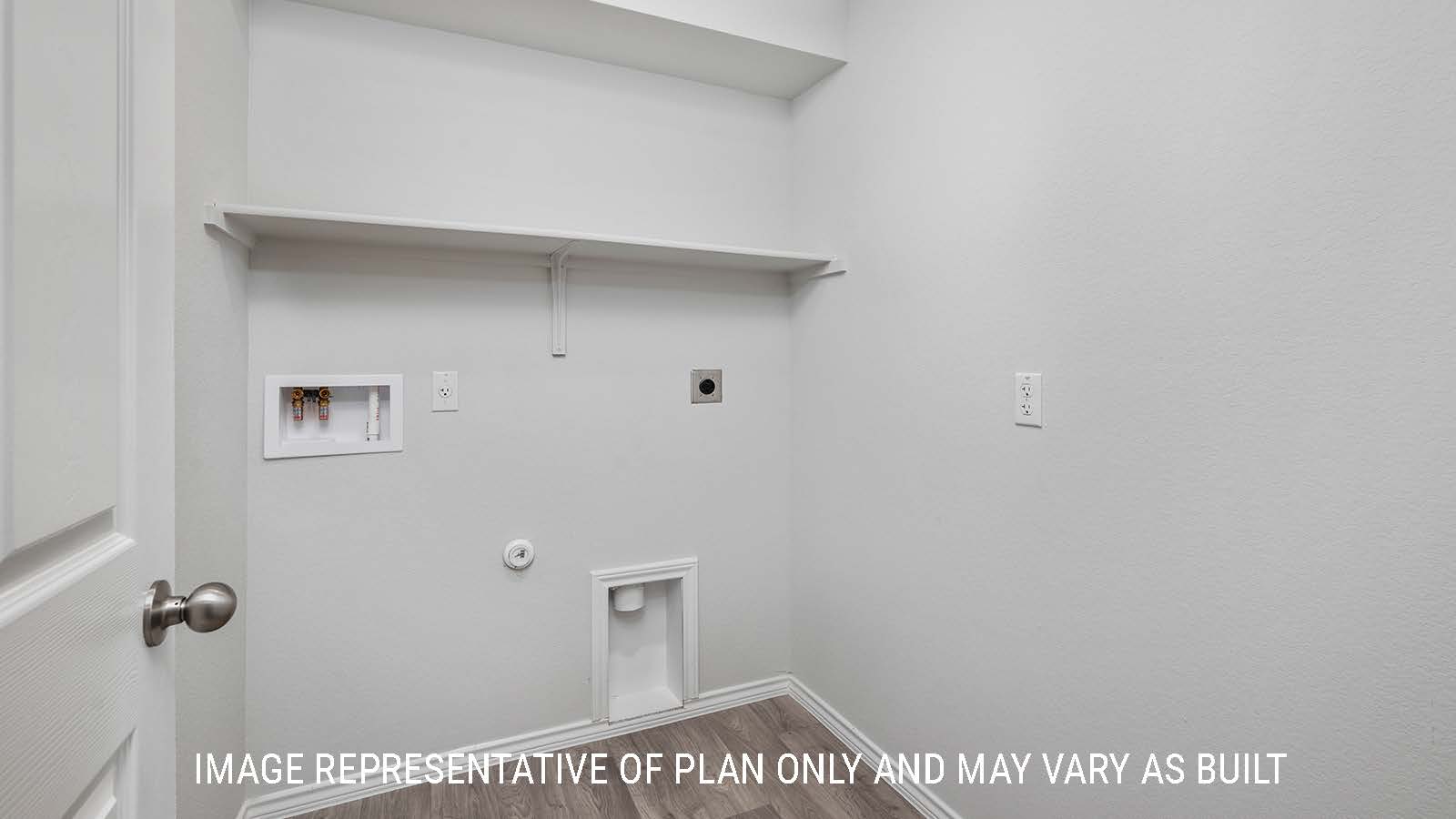 Ashburn utility room with shelving and washer and dryer connections.