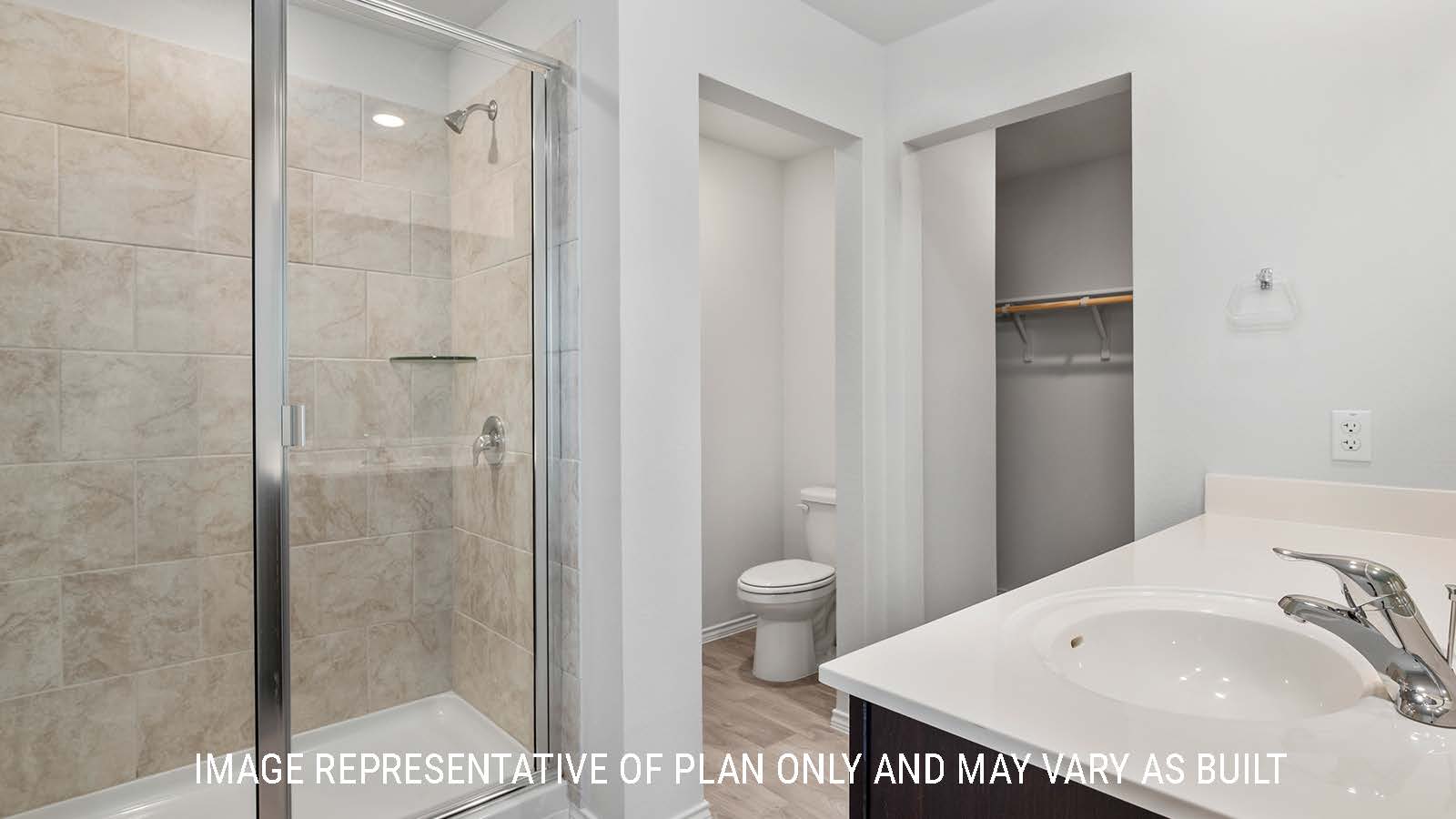 Ashburn primary bathroom with single vanity sink and walk-in shower.