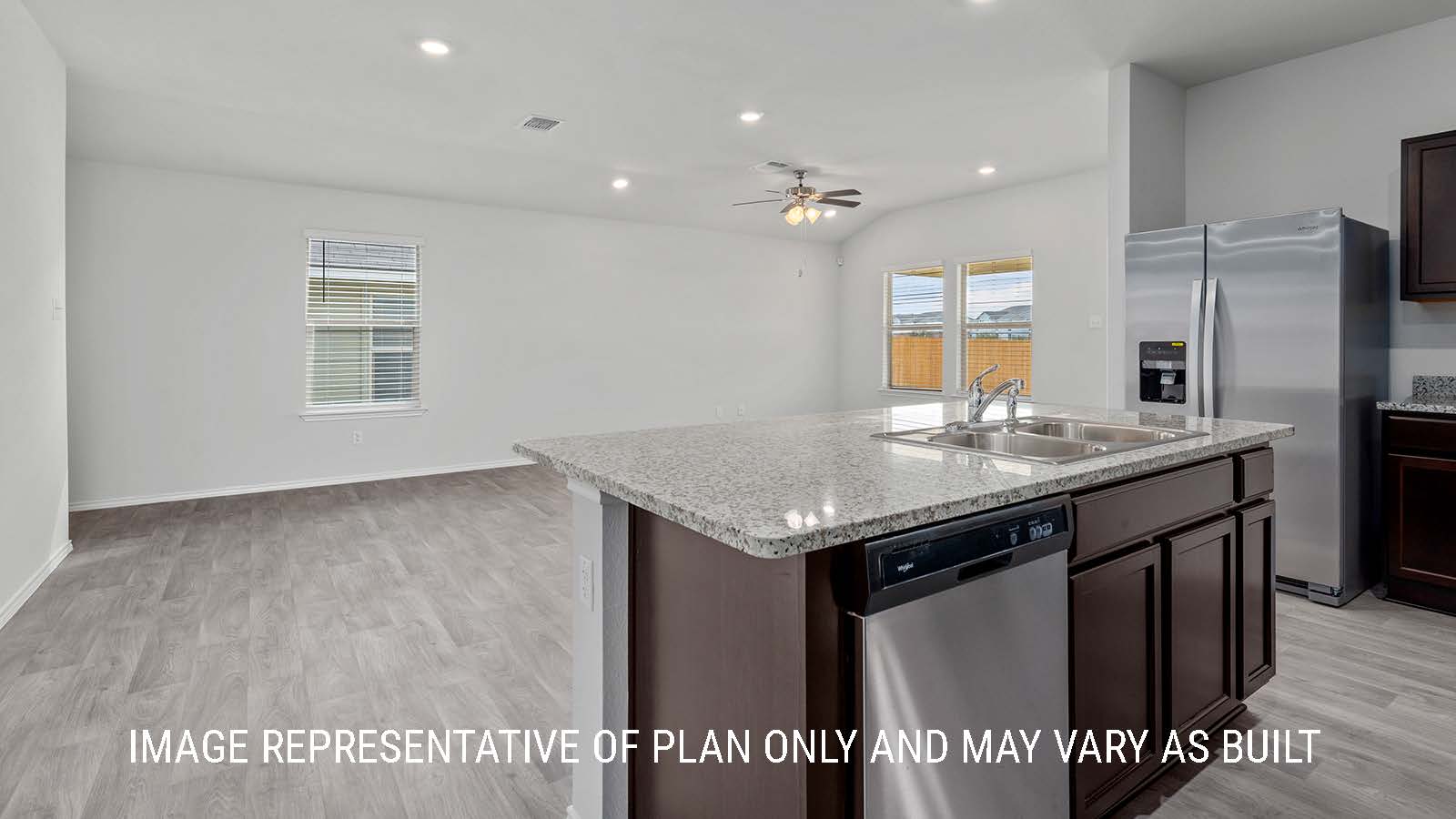Camden kitchen with center kitchen island with granite countertops.