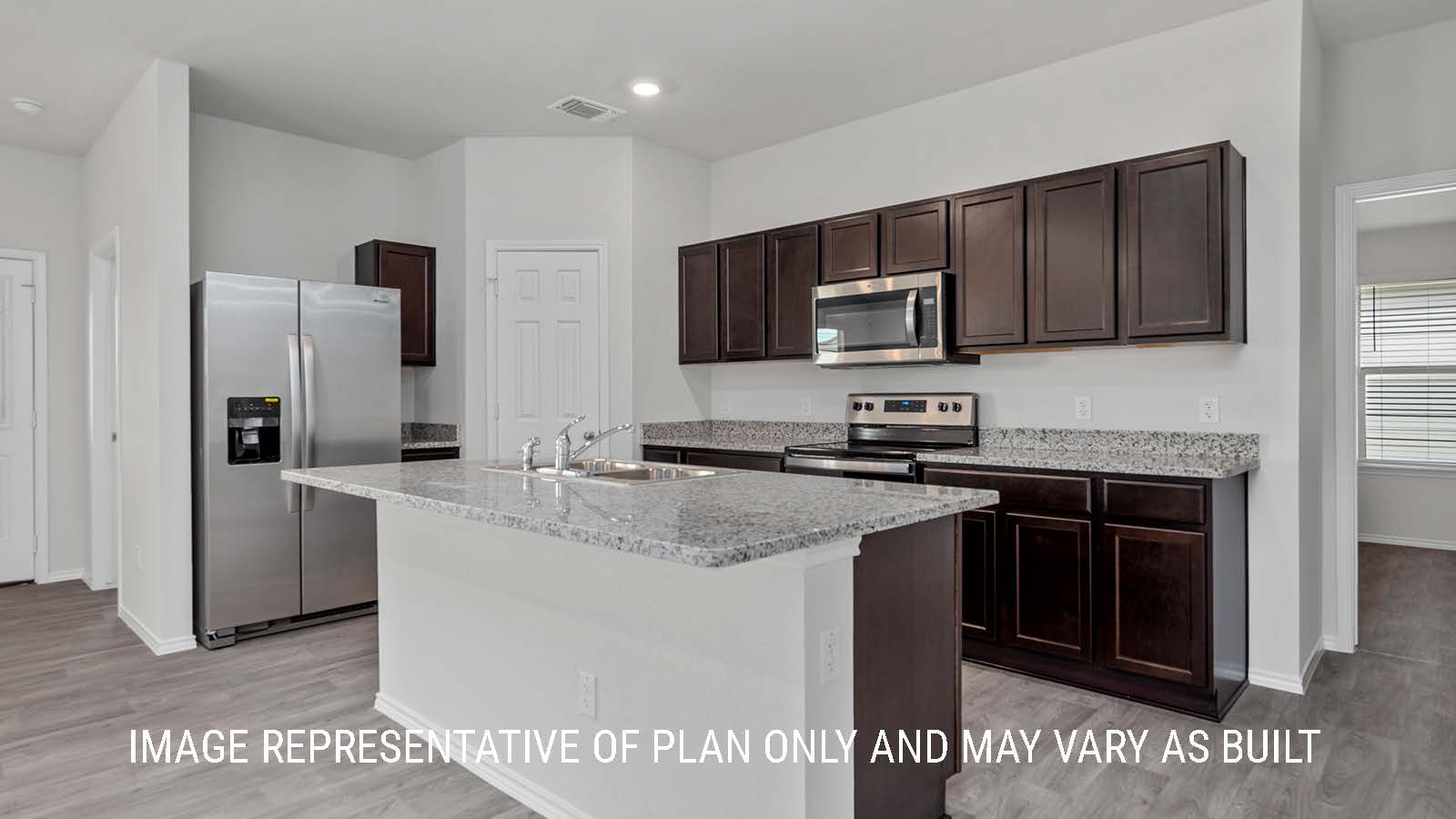 Camden kitchen with center kitchen island with granite countertops.