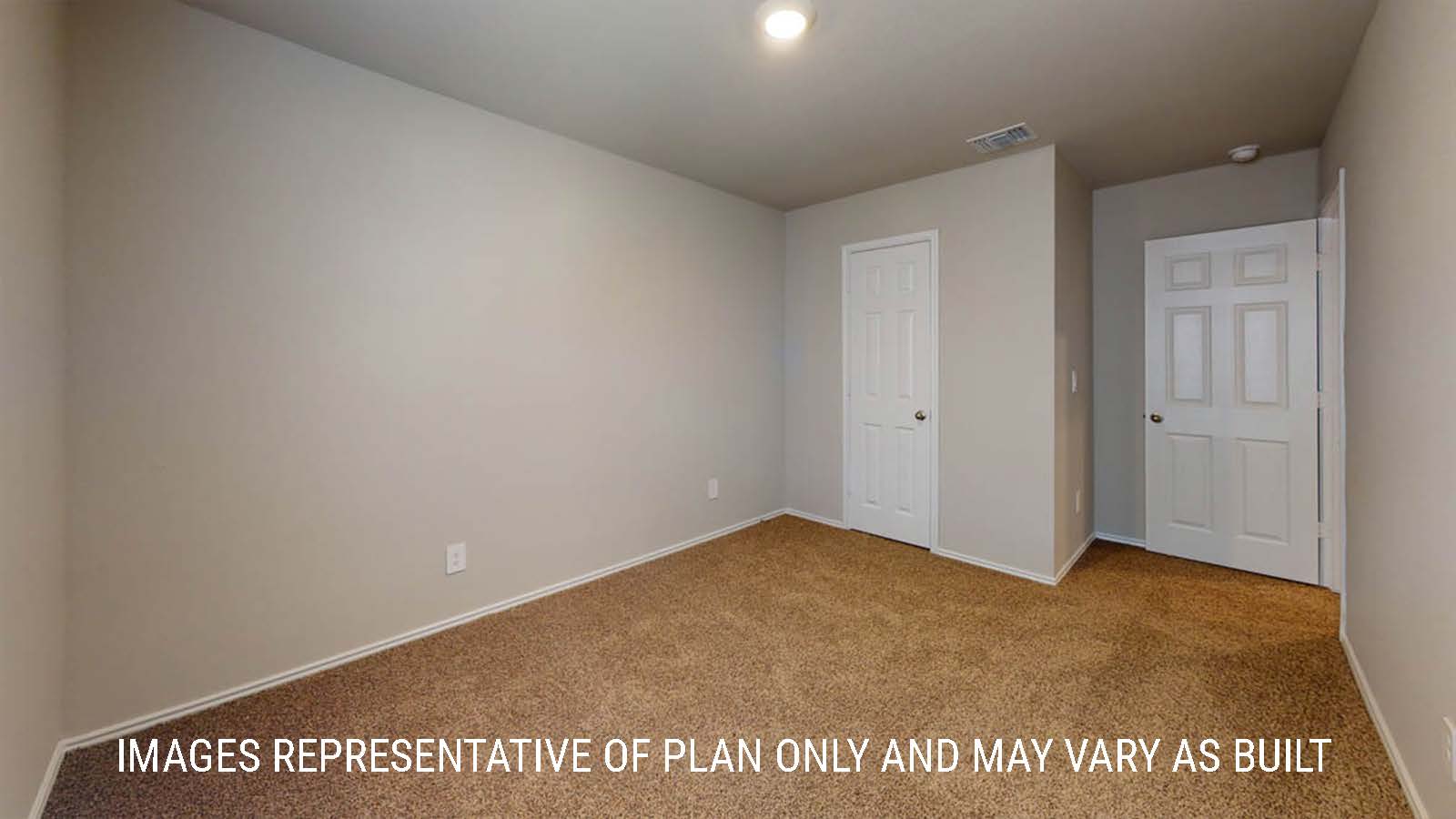 Elgin secondary bedroom with closet and carpeted flooring.