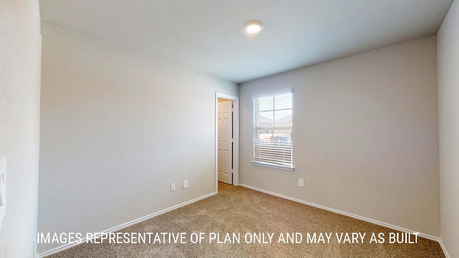 Fargo secondary bedroom with window and carpeted flooring.