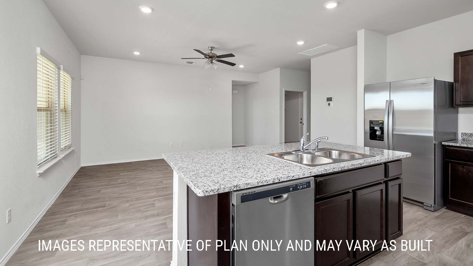 Fargo kitchen with kitchen center island with granite countertops.