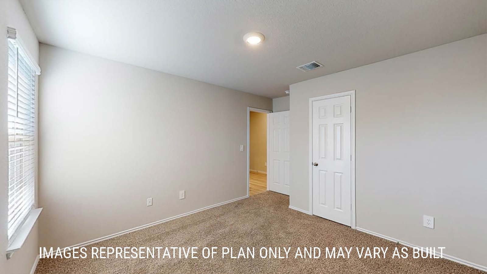 Texas Cali secondary bedroom with closet and carpeted flooring.