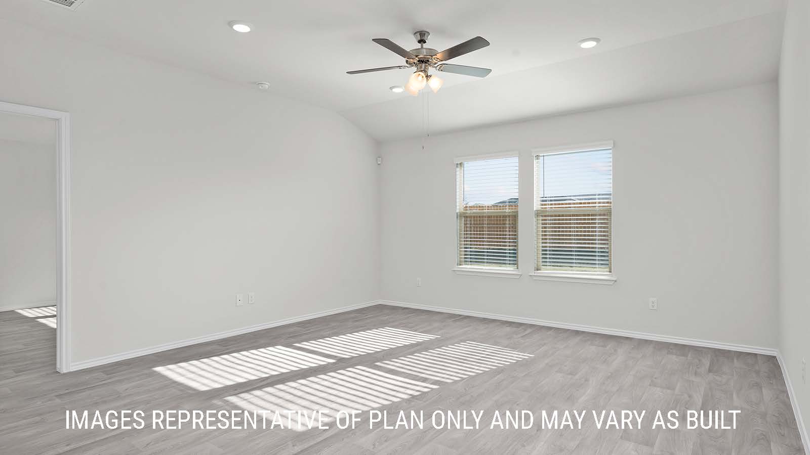 Texas Cali dining room with vinyl plank flooring and view of back door and backyard.