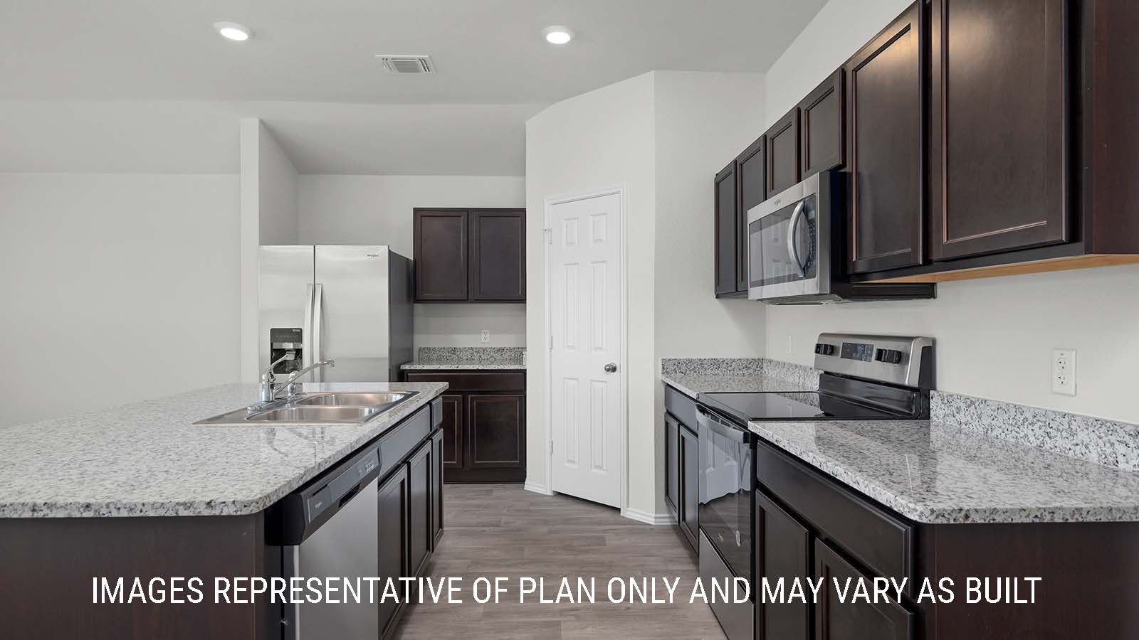 Texas Cali kitchen with granite countertops and dark cabinets.