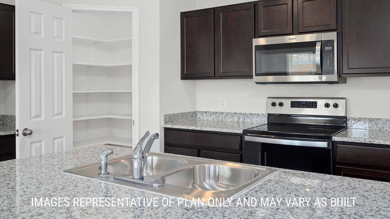 Texas Cali kitchen with granite countertops and dark cabinets.