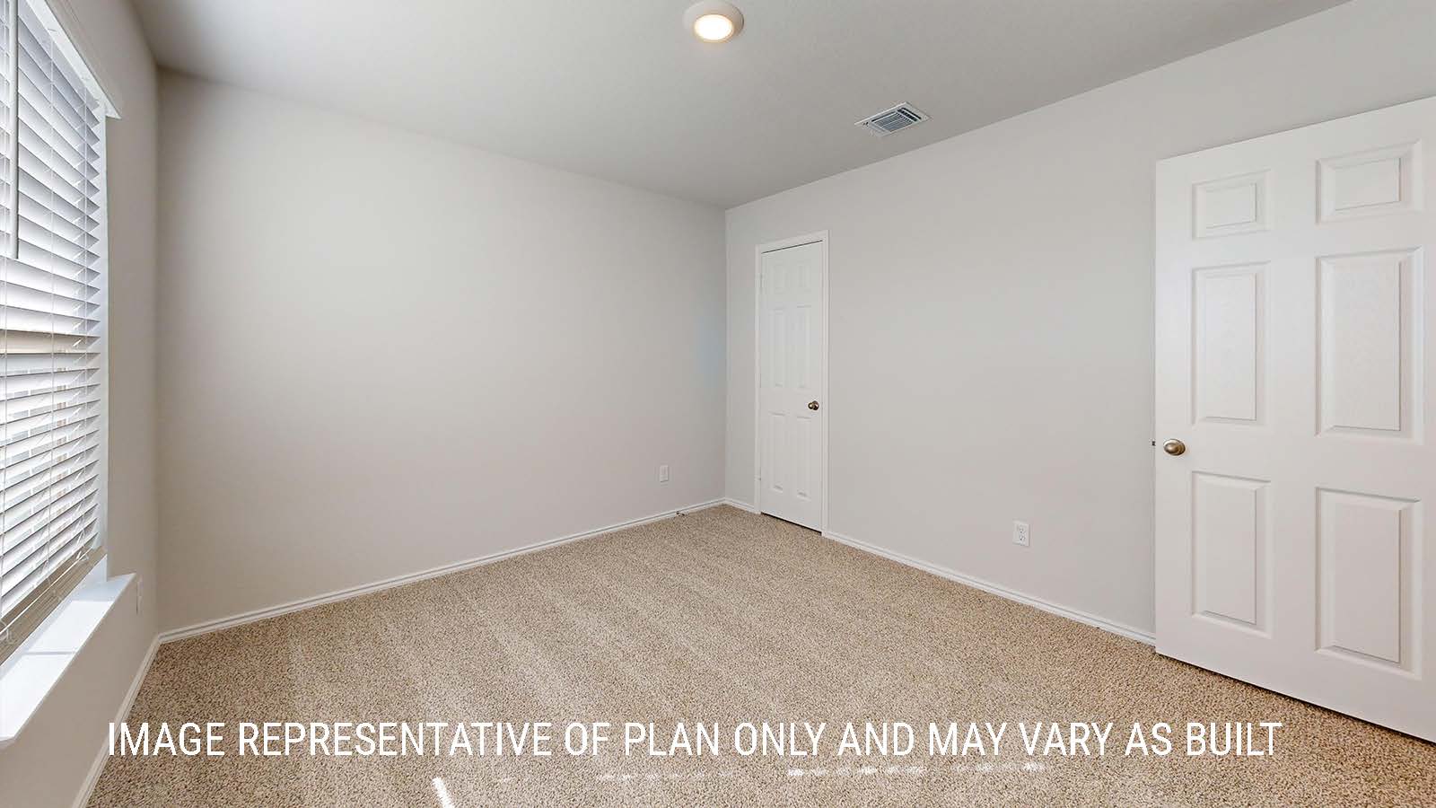 Seabrook secondary bedroom with carpeted flooring and window for lighting.
