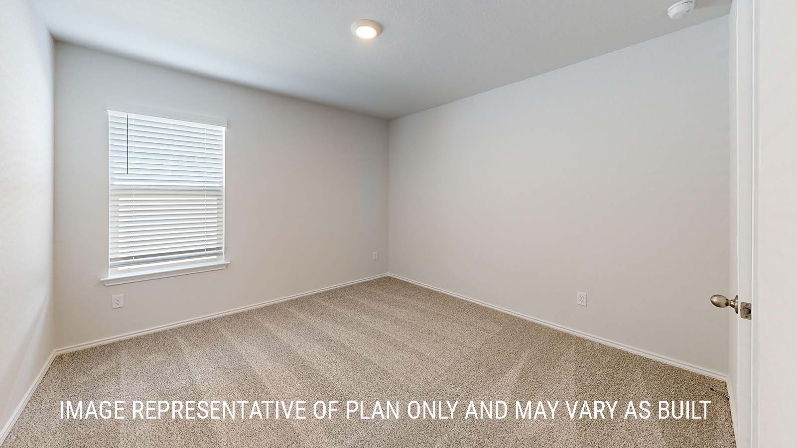 Seabrook secondary bedroom with carpeted flooring and window for lighting.