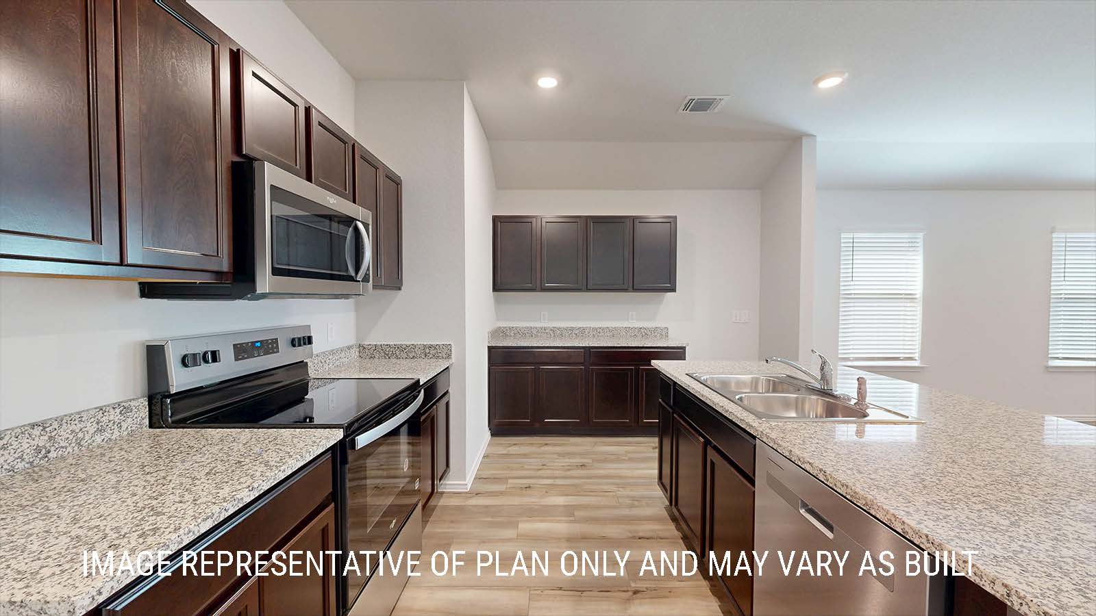 Seabrook kitchen with dark cabinets and granite countertops.