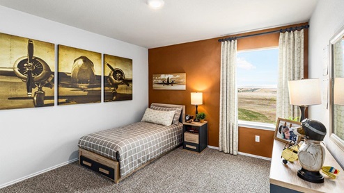 Mitchell Farm model home secondary bedroom with a twin bed and accent decor.