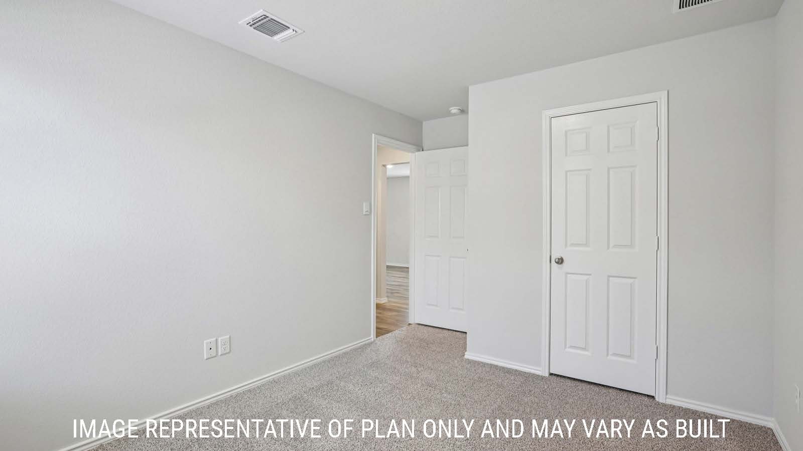 Caprock secondary bedroom with carpeted flooring and view of hallway.