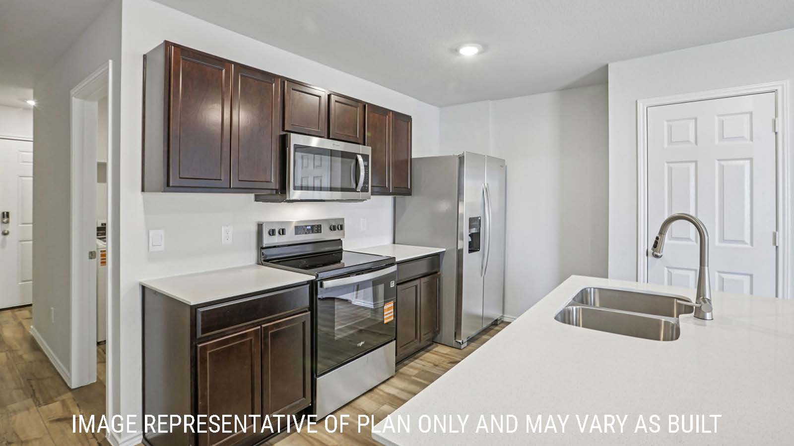 Caprock kitchen with granite countertops and dark cabinets.