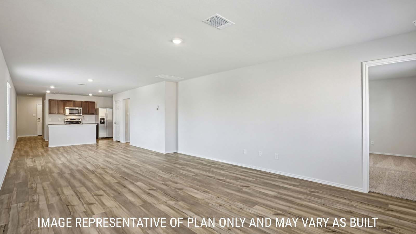 Caprock living room with vinyl plank flooring and view of open concept dining room and kitchen.