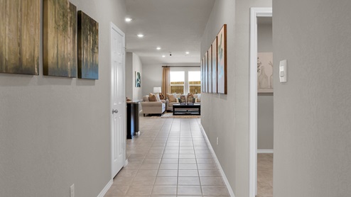 Victory Ranch model home entry hallway with tile flooring.