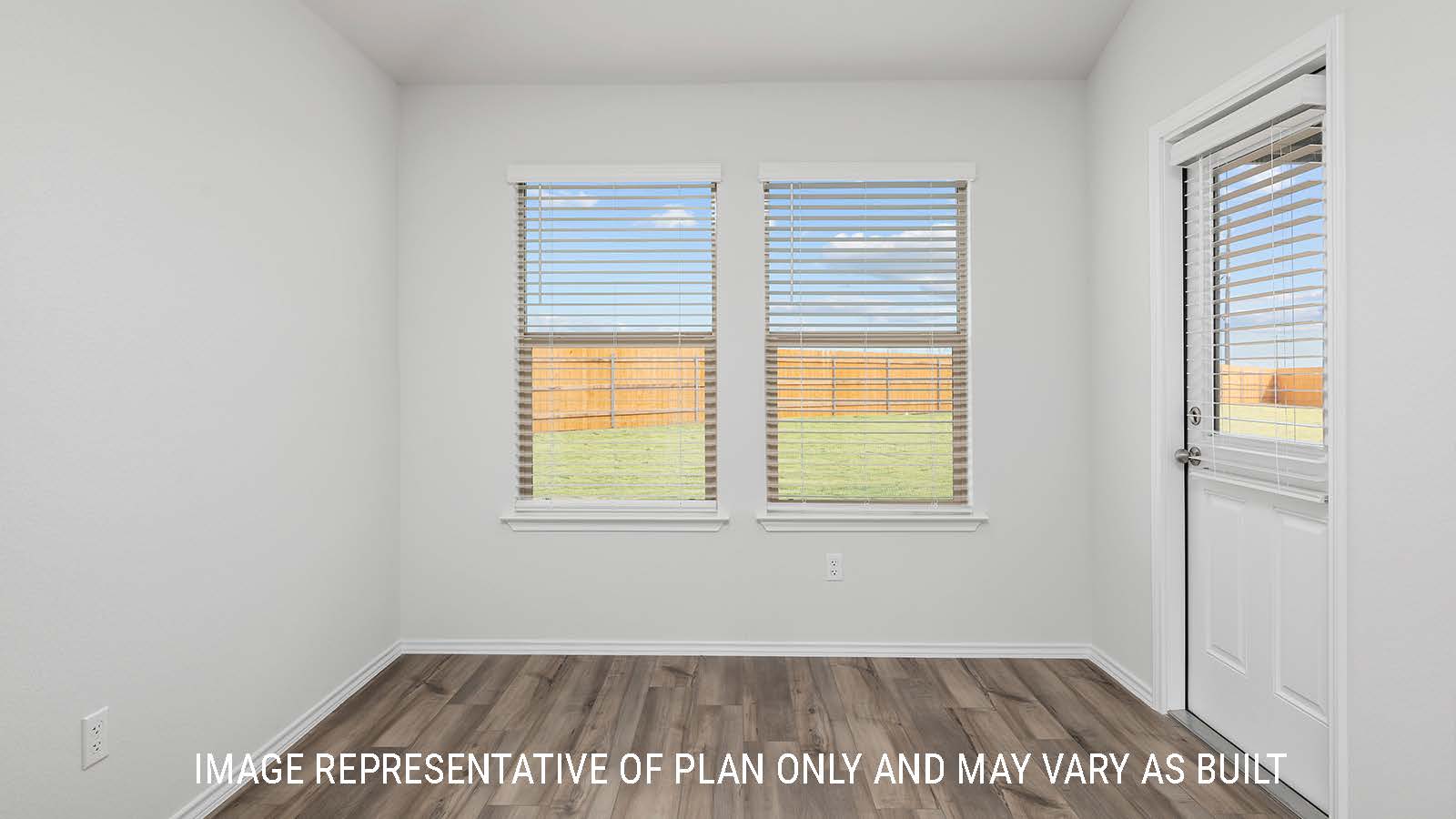 Bellvue dining room with windows and view of the backyard.