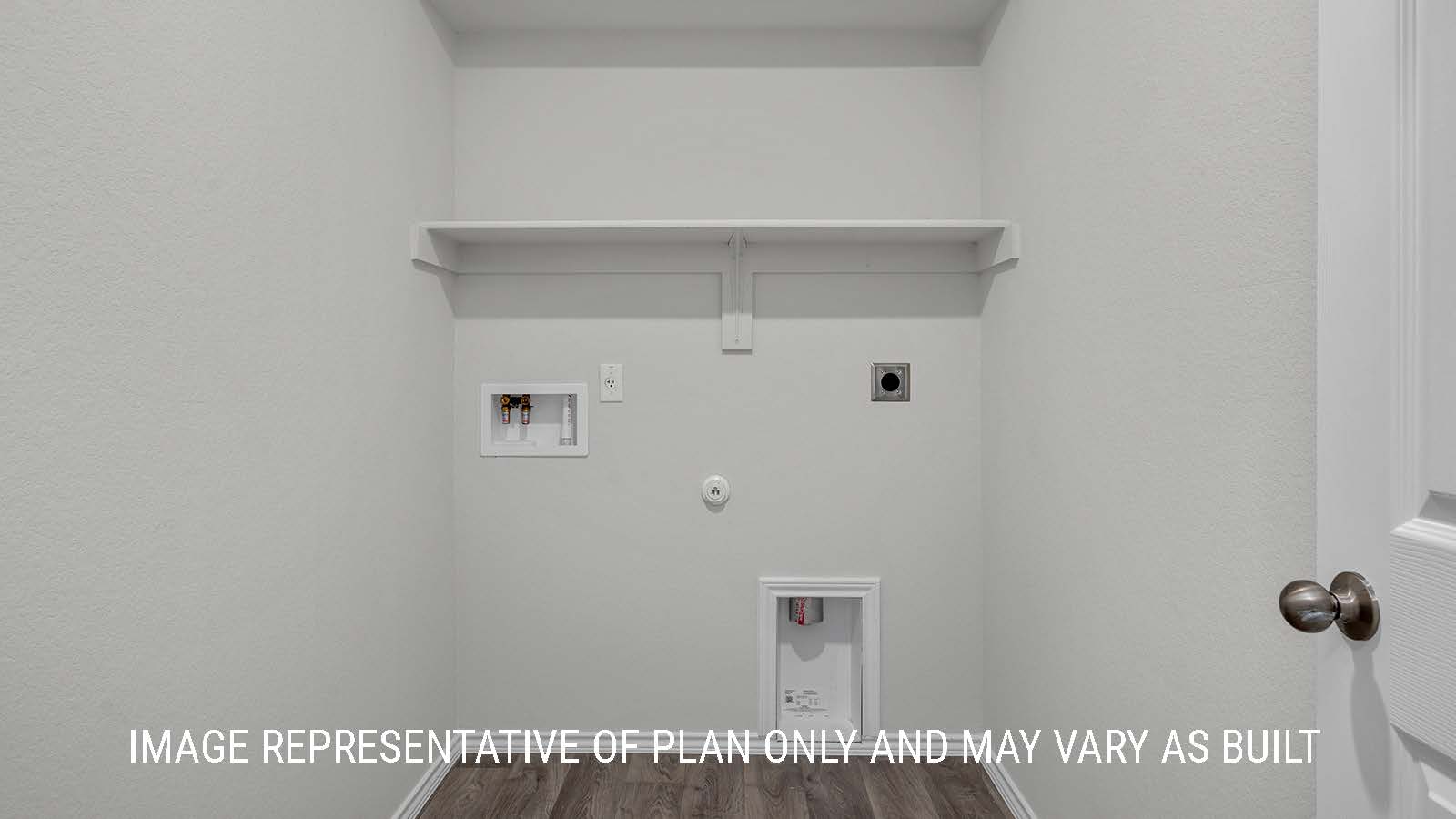 Camden utility room with shelving and washer and dryer connections.