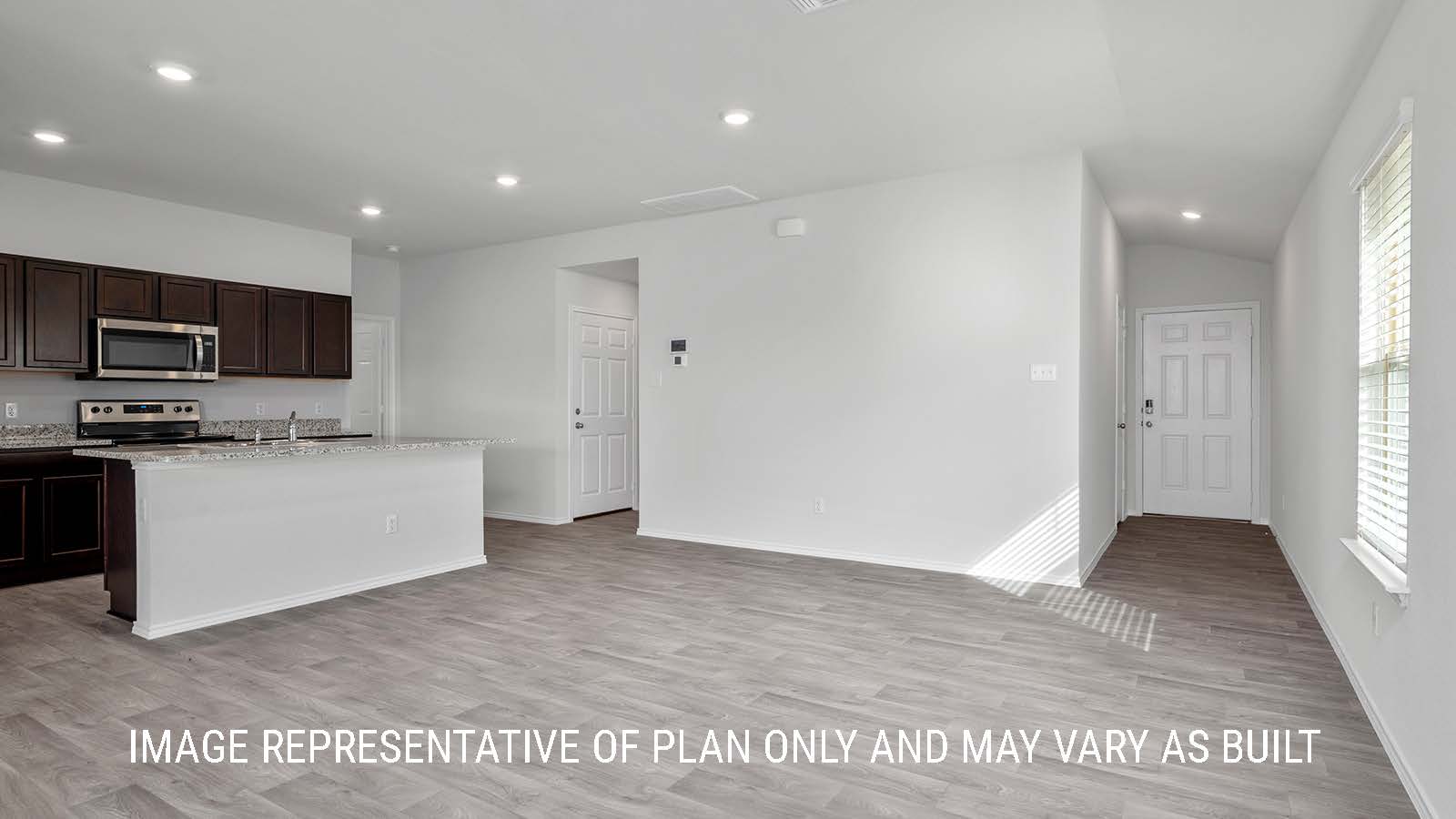 Camden living room with vinyl plank flooring and view of the entry way.