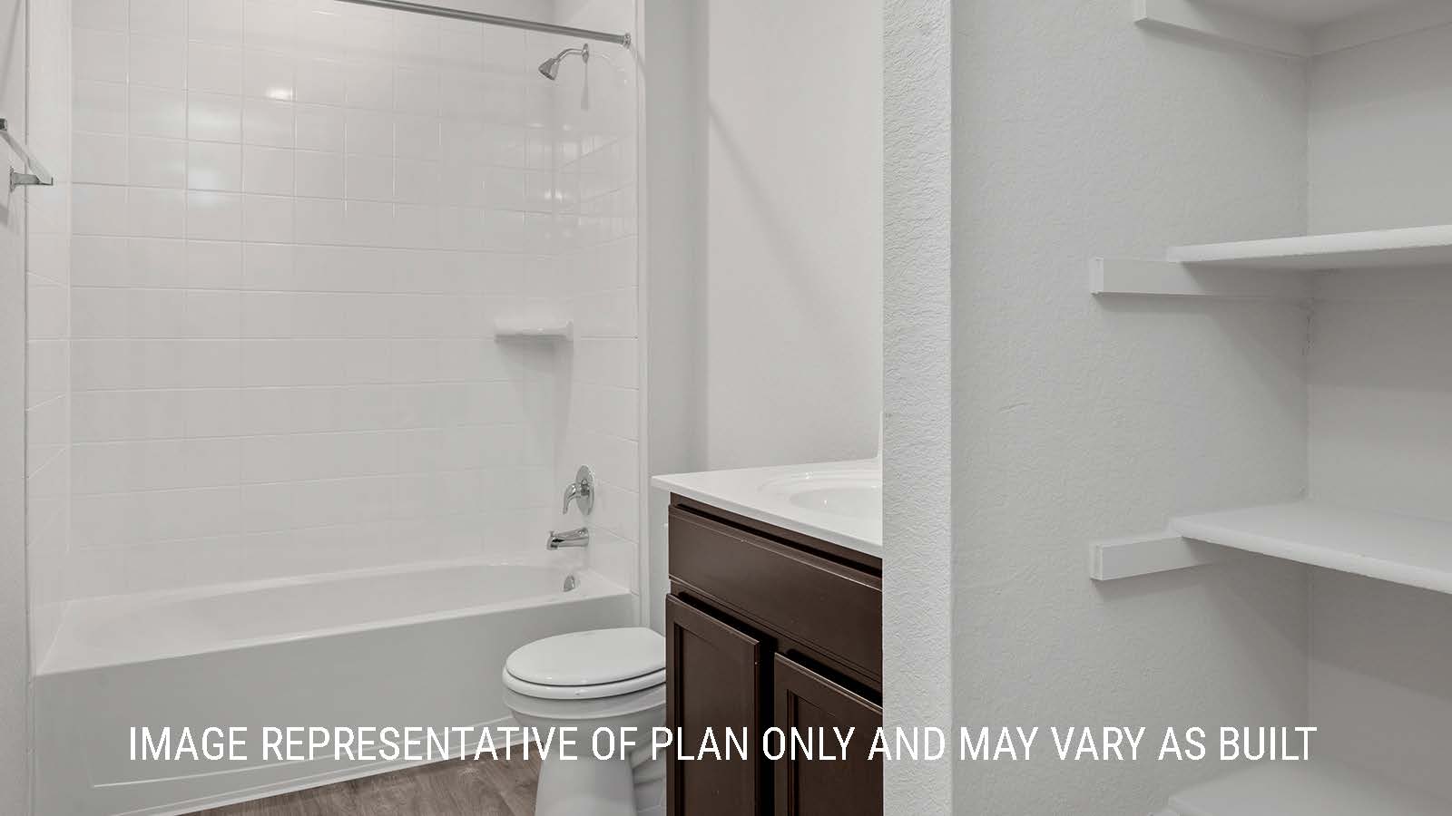 Camden secondary bathroom with single vanity sink and shower and tub combo.