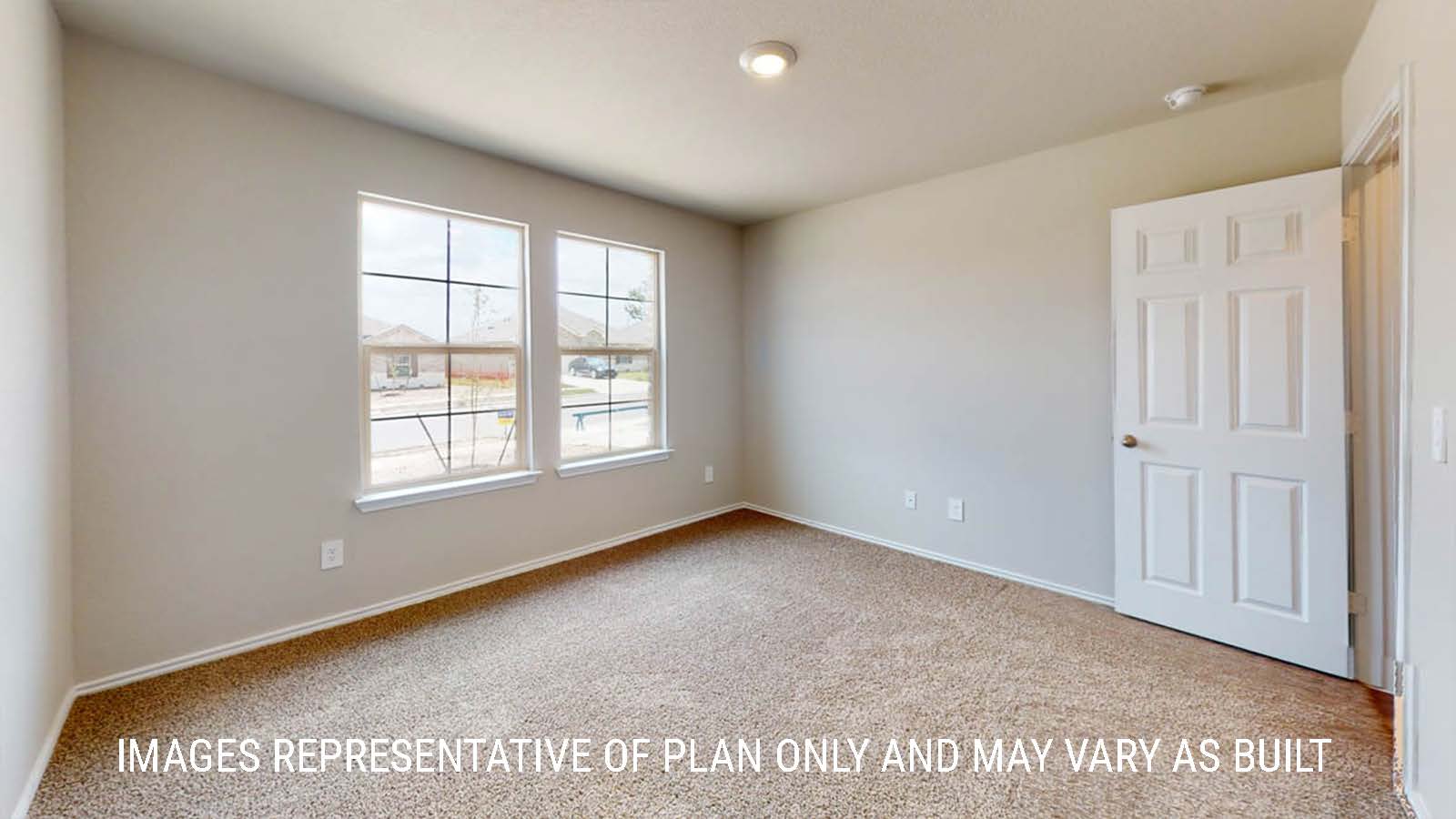 Elgin secondary bedroom with windows and carpeted flooring.