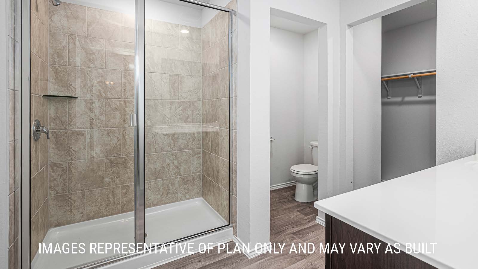 Elgin primary bathroom with single vanity sink and walk-in shower.