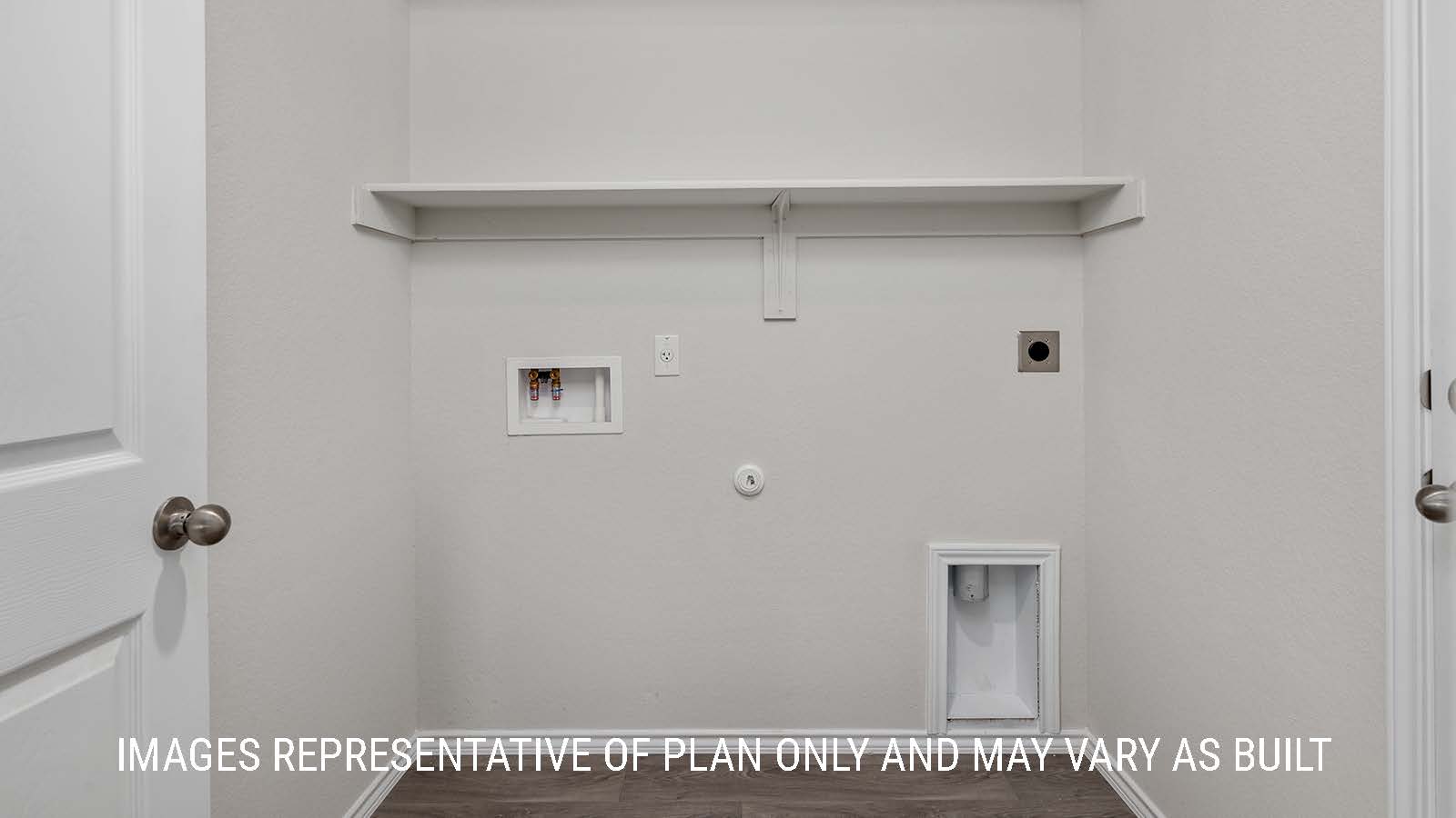 Fargo utility room with shelving and washer and dryer connections.