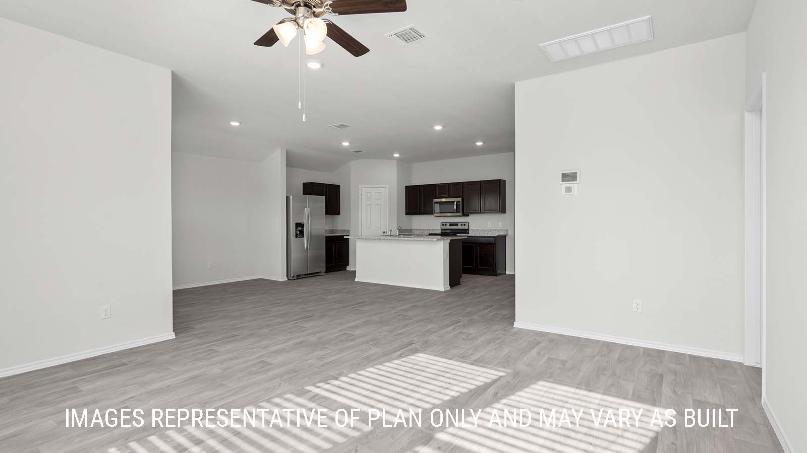 Texas Cali living room with view of kitchen center island and granite countertops.