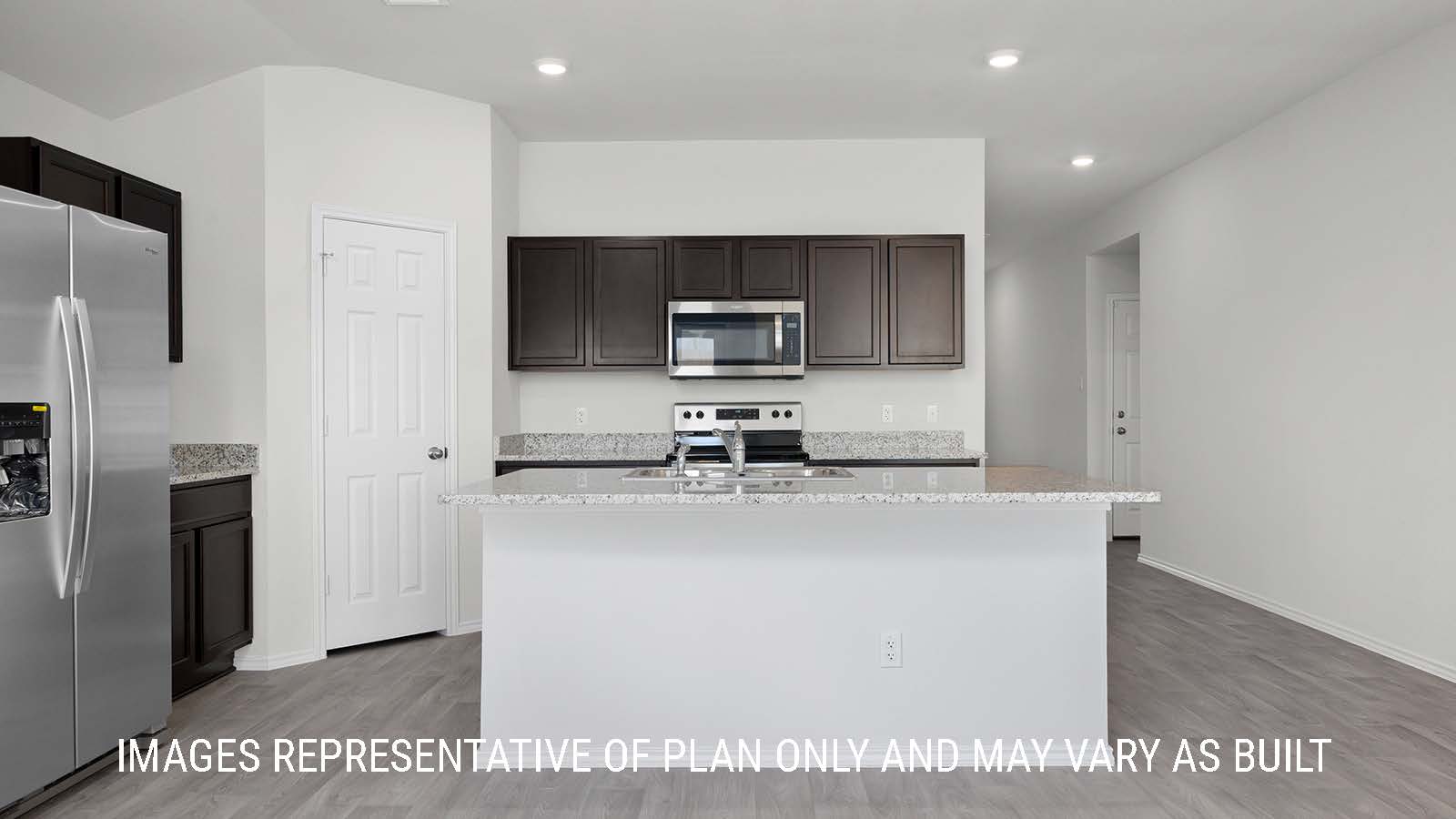 Texas Cali dining room with vinyl plank flooring and view of back door and backyard.