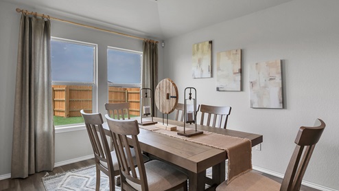 West Canyon Trails Model Home Dining room with table and windows