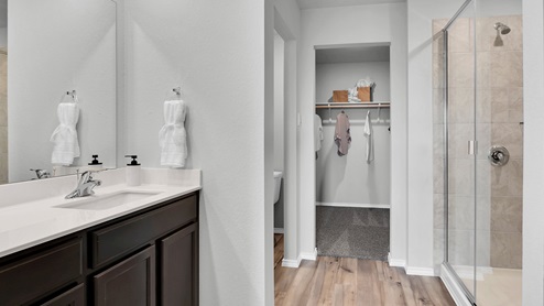 West Canyon Trails Model Home primary bathroom with view of closet