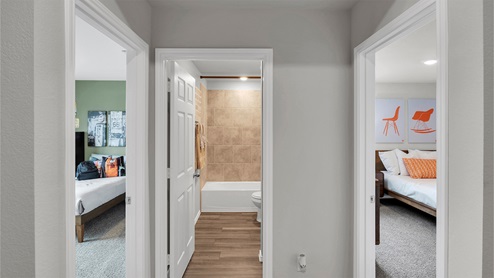 Eastern Wells Model Home view of secondary bathroom in hall between secondary bedrooms.