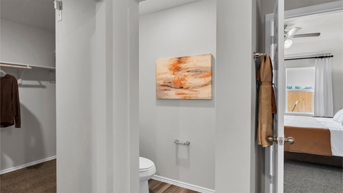 Eastern Wells Model Home primary bathroom water closet.