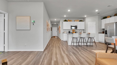 Eastern Wells Model Home with open concept kitchen and living room.